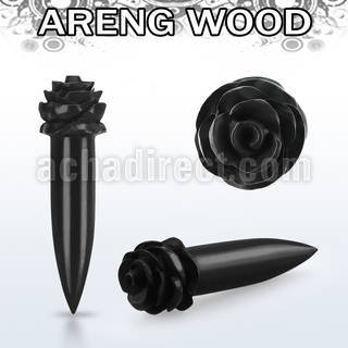 tparfl areng wood taper with a hand carved rose shaped top